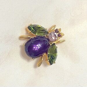 Costume jewelry bug brooch. Four different colors on gold tone. Working clasp.